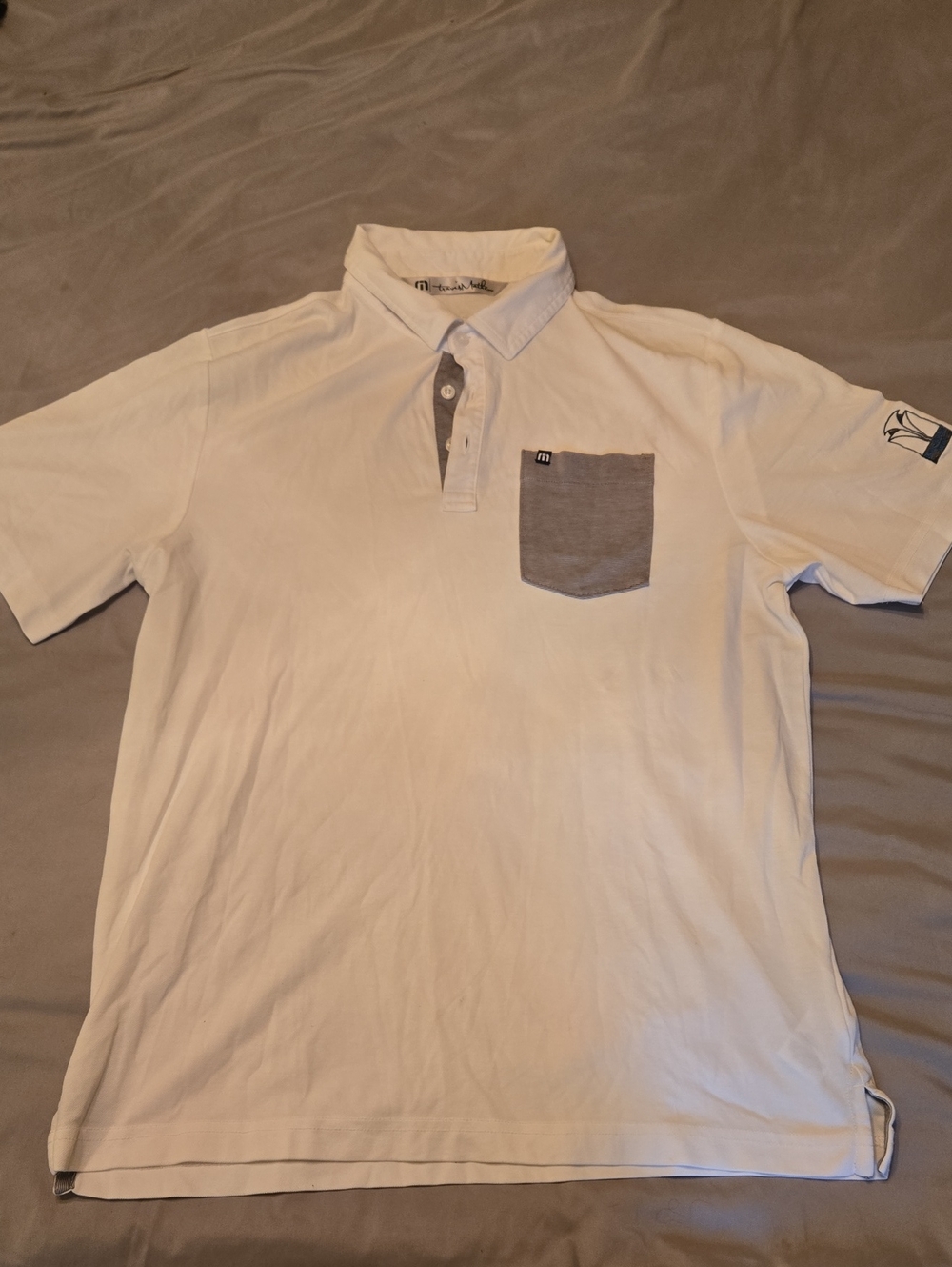 Travis Mathew White Polo with Gray Chest Pocket